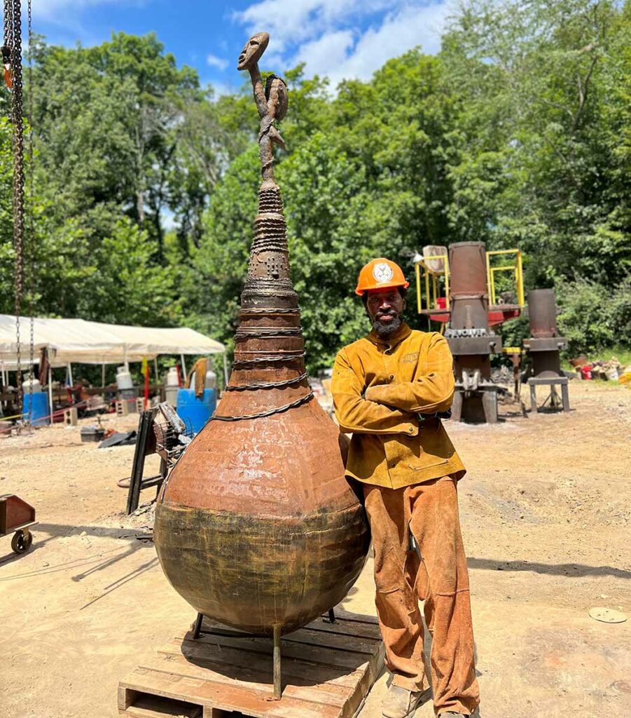 Sculptor with his large scale metal work