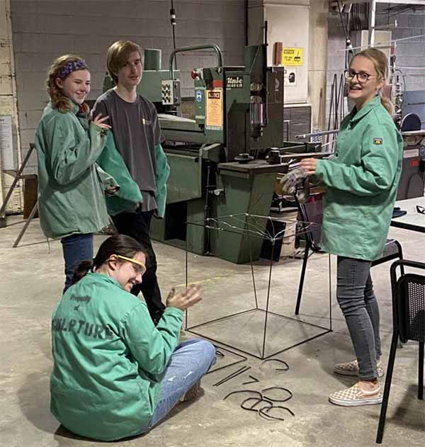 High School Art Academy, a picture of students in the metalworking class