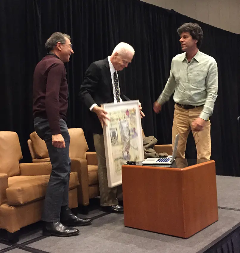 Bud Shark (left) and Andy Saftel (right) present Red Grooms the Lifetime Achievement Award at the 2015 SGC International Conference.