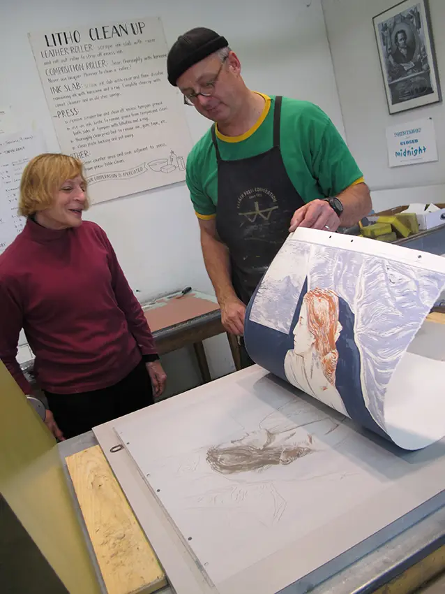 Ruth Weisberg with Beauvais Lyons as they work on a lithograph in 2011.