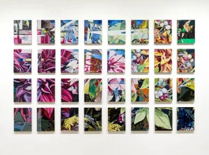 Array of many paintings on the wall making up one large image of flowers and plants by Jered Sprecher