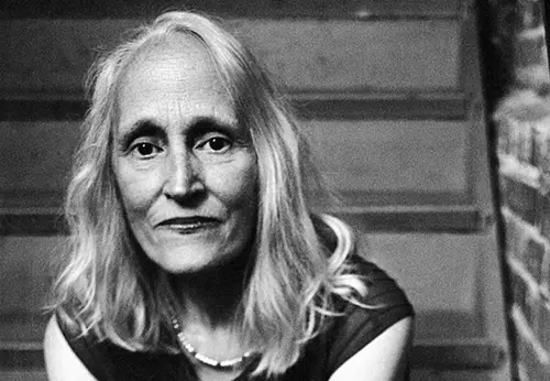 Black and white headshot photo of a woman