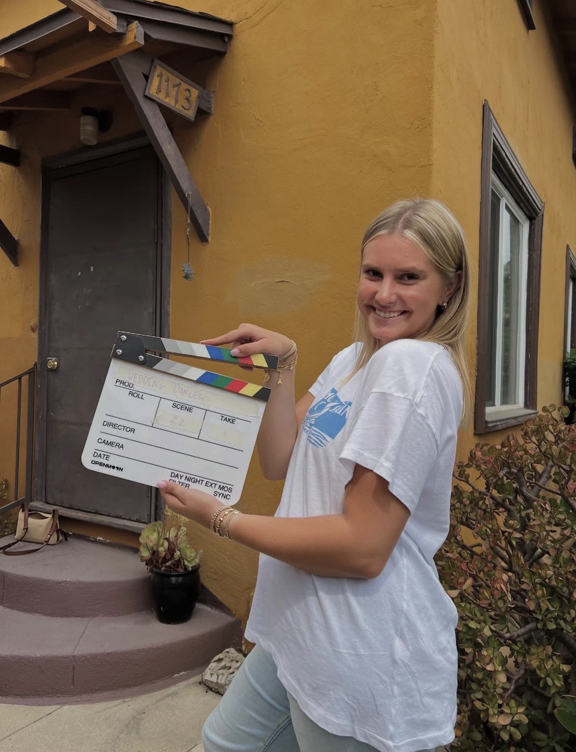 A student holding a slate