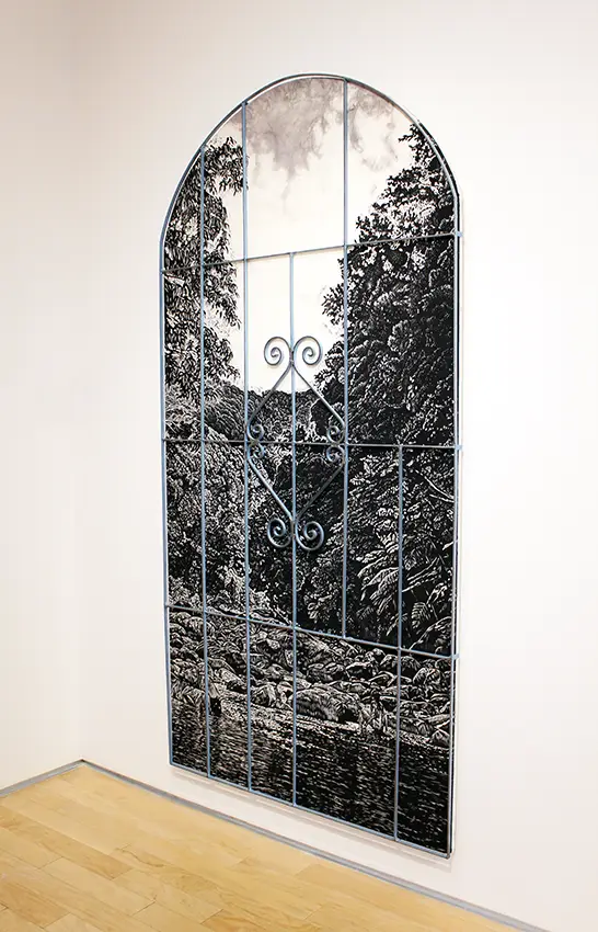 An artwork made into the shape of an arching window from woodcut and pastel. 
