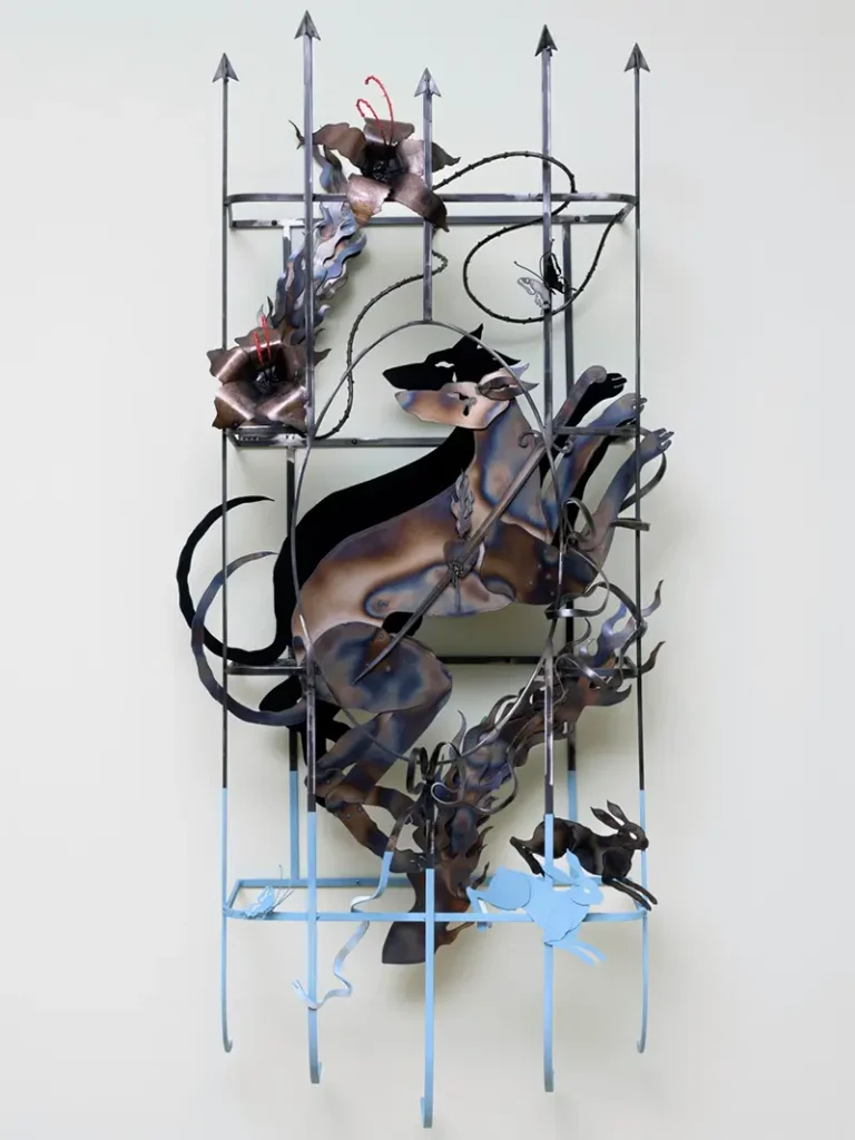 Piece of metal, metallic casted artwork titled "Spirt Lays Their Hand."