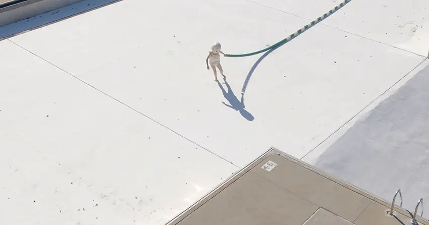 Artistic image of a lone body in the middle of an empty concrete area. 